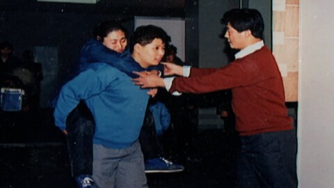 Falun Gong Story Rise of Falun Gong Master Li Healing Asia Expo Patient on back